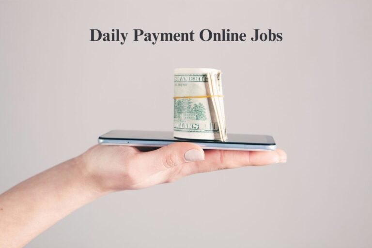 Hand holding smartphone with money stack representing daily payment online jobs without investment